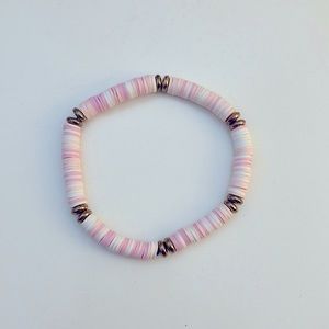 Handcrafted pink and white bracelet.